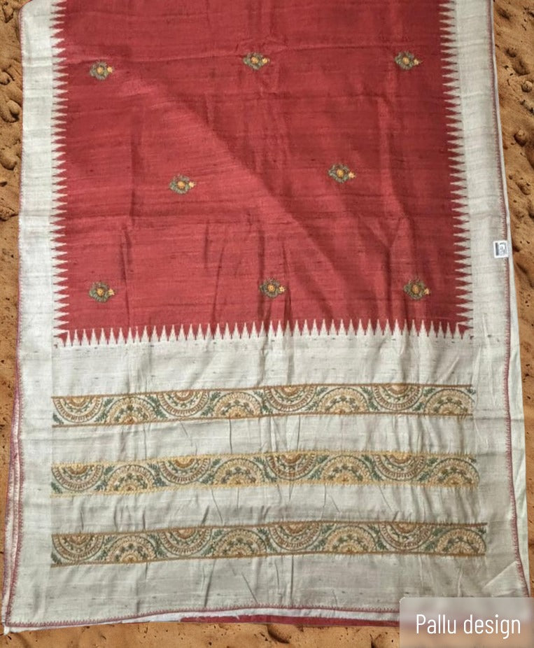 Elegant terracotta saree with floral Kantha embroidery and woven pallu 