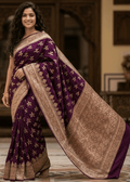 Wine and orchid dualtone handwoven Banarasi silk saree with gold zari floral booti motifs and ornate woven border, draped on model