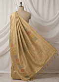 Antique gold Banarasi saree with pastel hexagon meenakari motifs draped on mannequin
