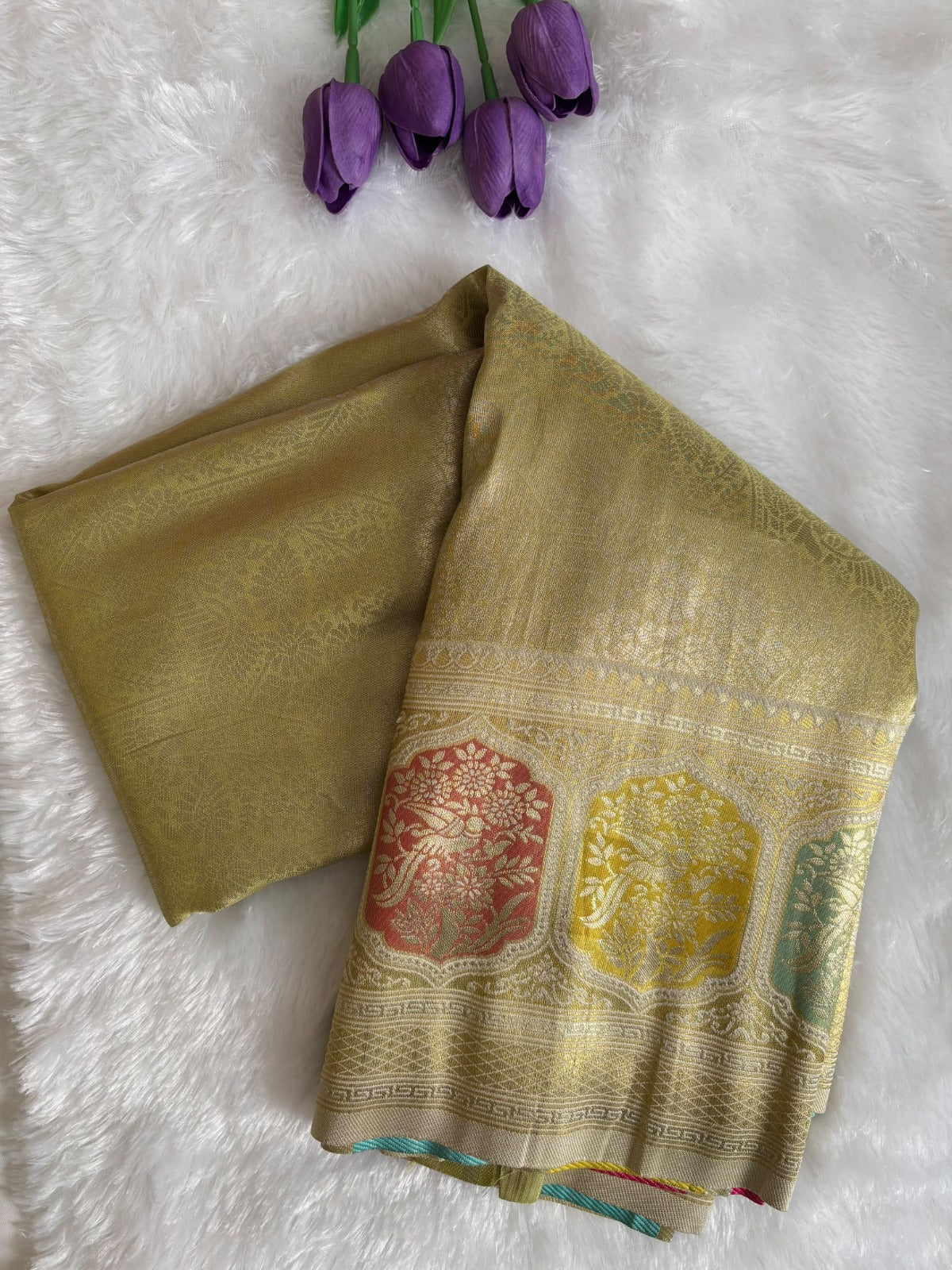 Close-up of peach, mint and yellow hexagon meenakari motifs on gold Banarasi saree border