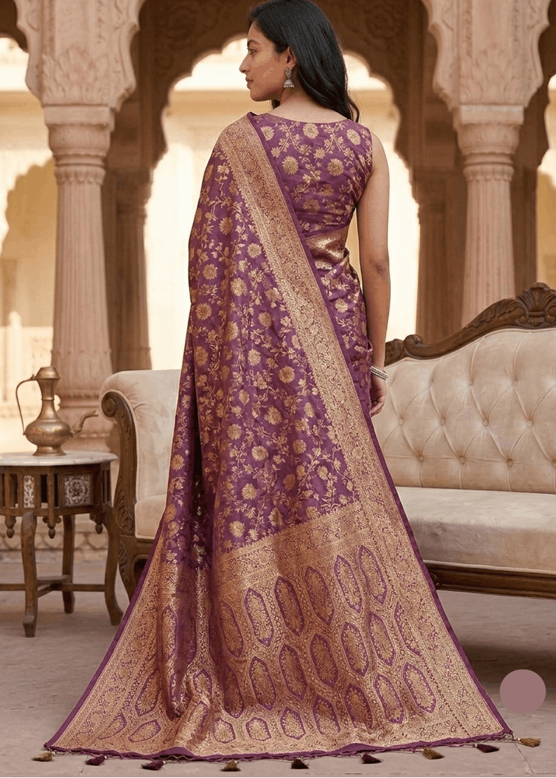 Intricate antique gold geometric honeycomb zari pallu on wine purple Banarasi silk saree — festive bridal