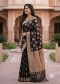 Woman draped in midnight black Baluchari silk saree, heritage handloom