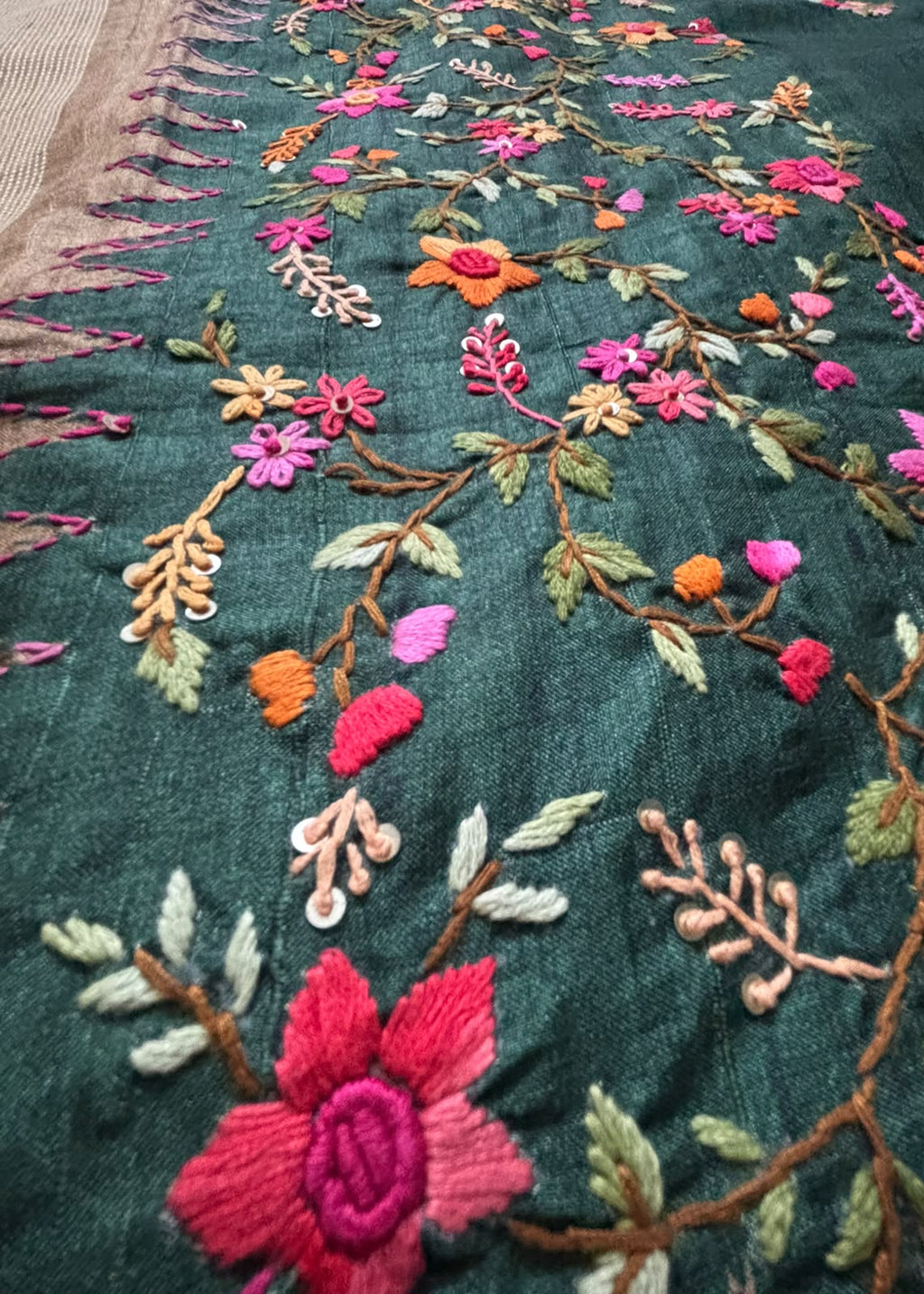 Colourful floral butta Kantha embroidery on bottle green saree body