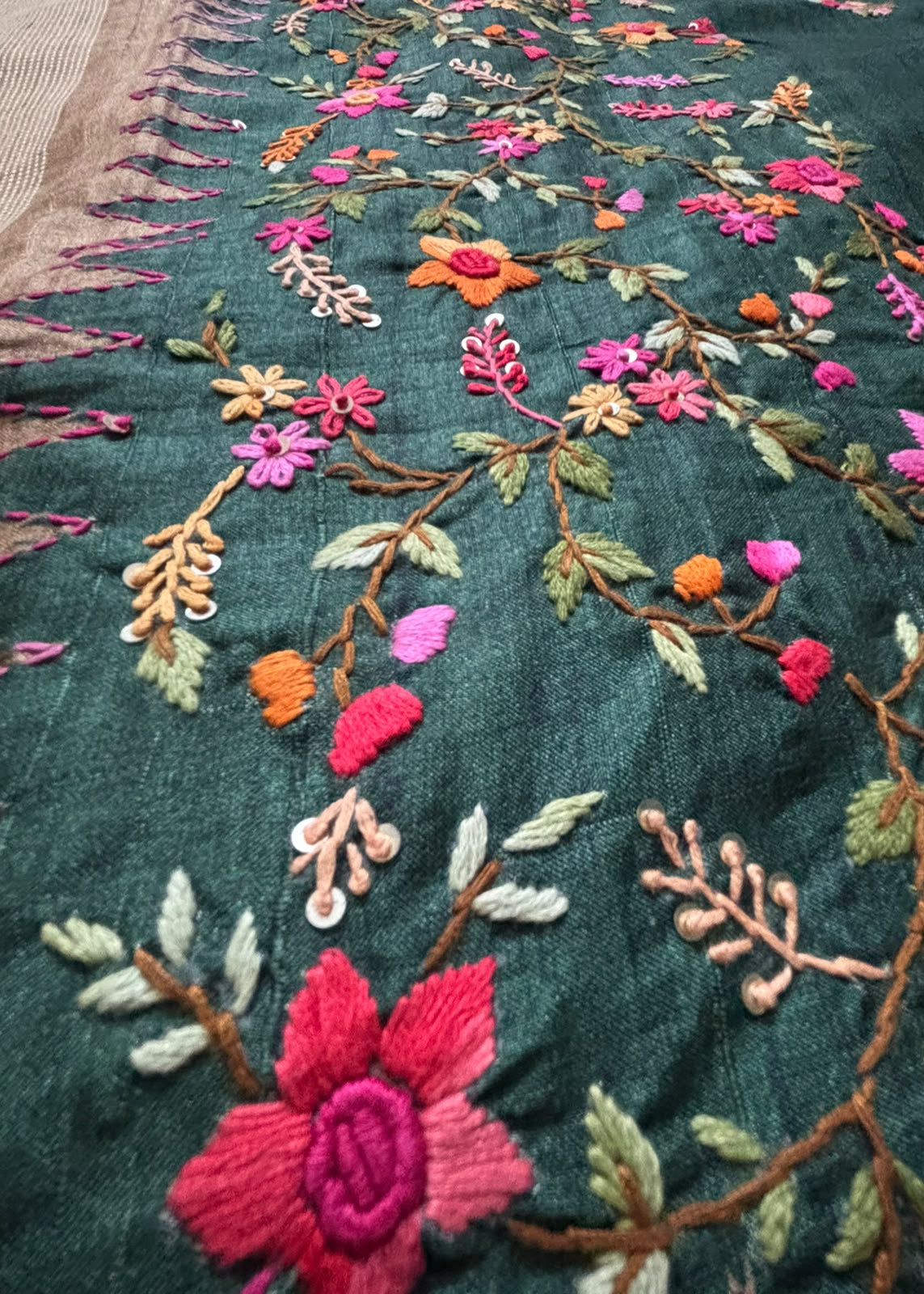 Colourful floral butta Kantha embroidery on bottle green saree body