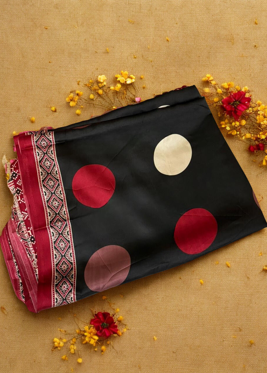 Black Modal silk ajrakh saree with red and white polka dots on a beige background with flowers.