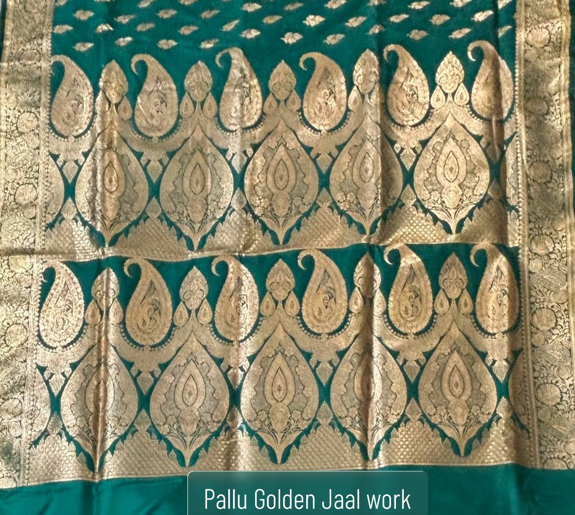 Oversized antique gold Mughal paisley zari pallu on teal green Banarasi silk saree — grand festive look