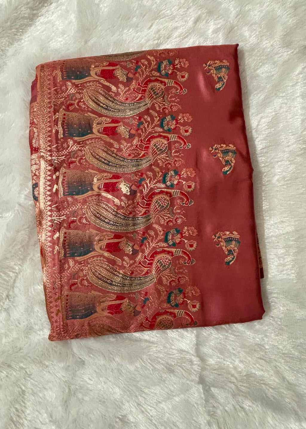 dusty rose peach Baluchari silk saree featuring subtle all-over motifs, a fine woven border, and an elaborate pallu depicting traditional paisley patterns and mythological artwork