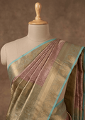 Dusty rose Banarasi silk saree with antique gold and sea green border draped on mannequin