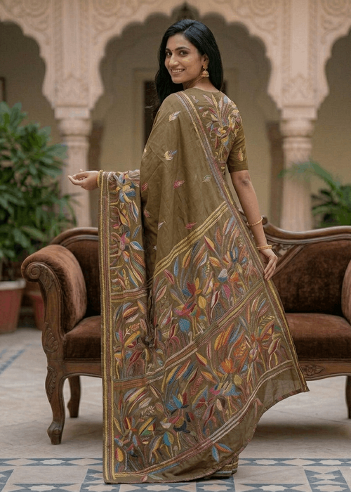 Woman wearing Forest Bloom Kantha saree with nature-inspired threadwork