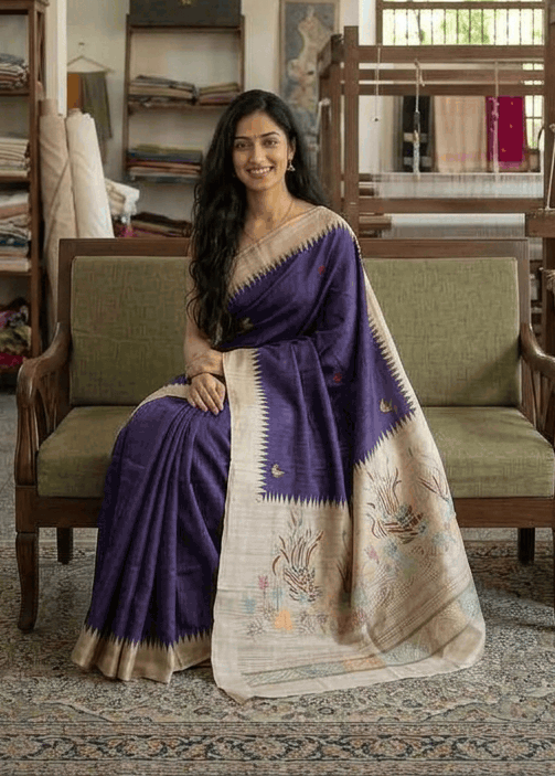 Woman wearing indigo Boolian Kantha saree with swan pallu for festive occasion