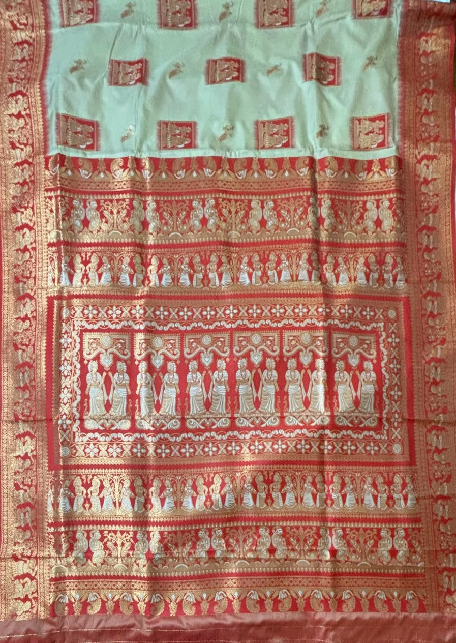 A traditional Indian Baluchari saree featuring an ivory-coloured body with red and gold zari patterns, including a wide red border with intricate gold motifs.