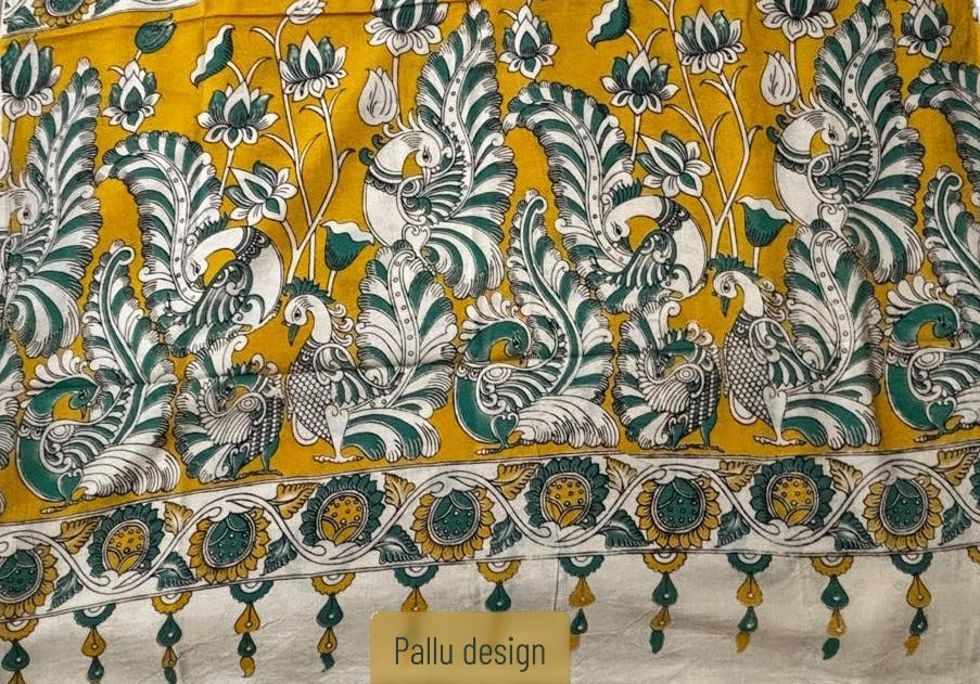 Mayurika premium magenta pink cotton Kalamkari saree featuring a contrasting mustard yellow pallu with traditional peacock and lotus motifs