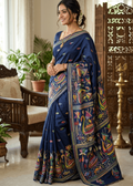Elegant royal-blue MeghMalhar Kantha Saree featuring intricate multicolour handcrafted floral and folk-art embroidery with artistic pallu detailing. Premium Bengal handloom saree ideal for festive wear, cultural occasions, office elegance, and timeless ethnic fashion.