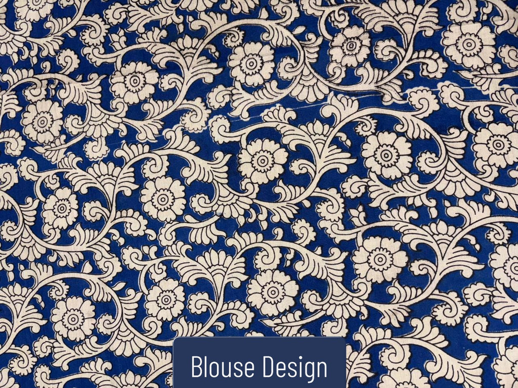 Indigo blue Kalamkari saree blouse design with intricate white floral vine pattern, traditional handcrafted ethnic blouse fabric detail