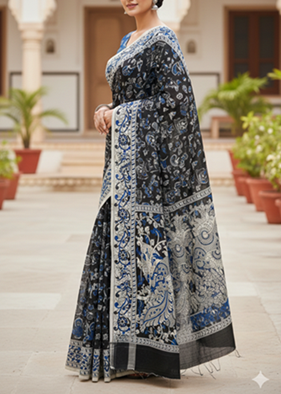 Side view of indigo Kalamkari saree with intricate floral border and folk motifs, handcrafted cotton saree styled for festive wear