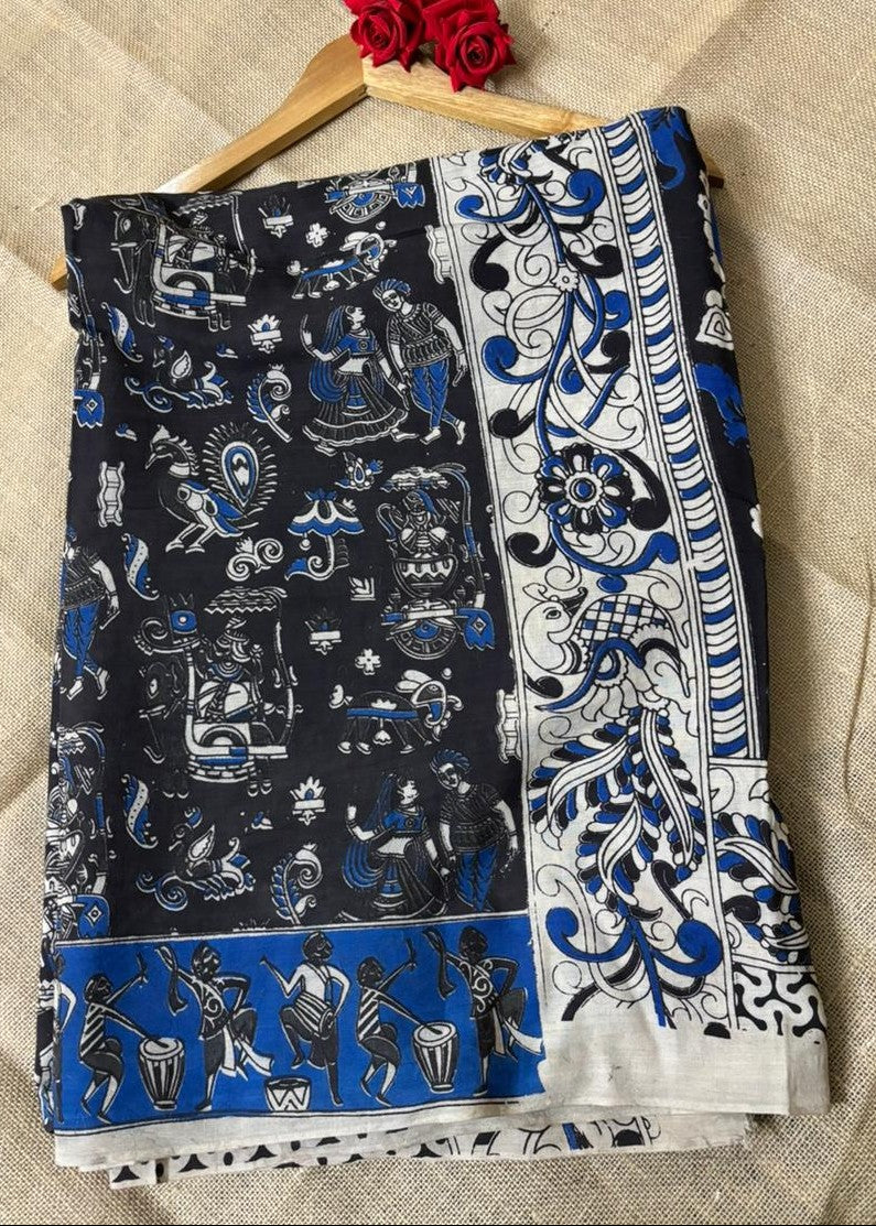 Neelambara indigo Kalamkari saree with folk art motifs and blue floral border, handcrafted cotton ethnic wear for festive and cultural occasions
