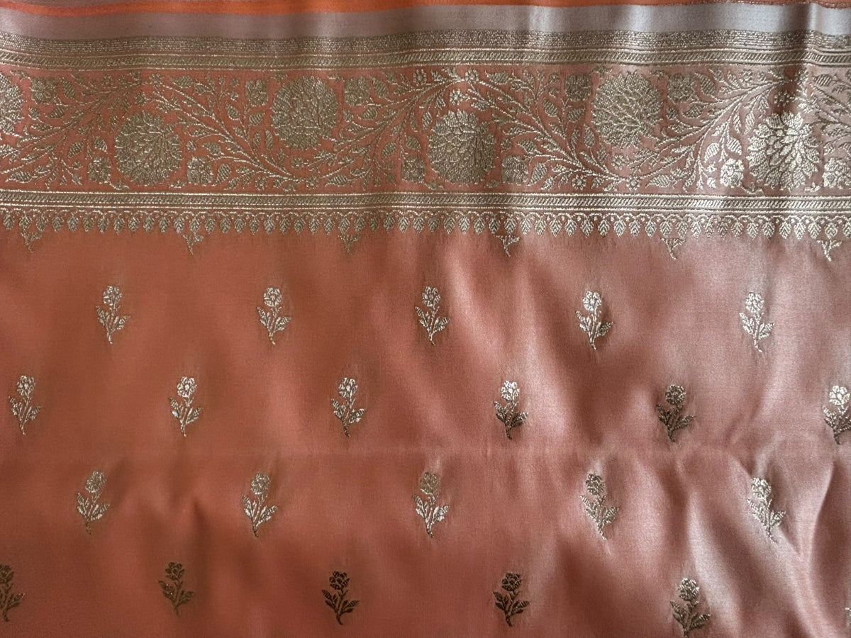 Close-up of rich gold zari paisley and jaal weave on the border