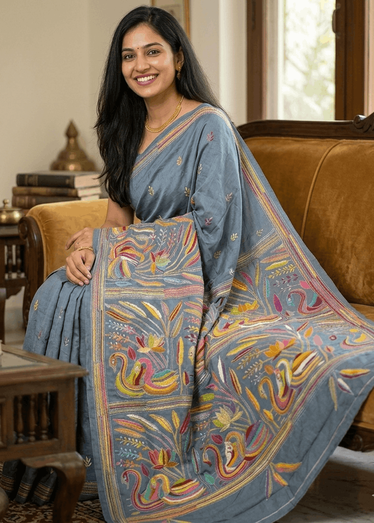 RangMayuri Kantha Stitch Saree in smoky grey cotton silk blend with vibrant multicolour handcrafted embroidery, artistic bird and floral motifs, and elegant Bengal handloom detailing perfect for festive and contemporary ethnic wear.