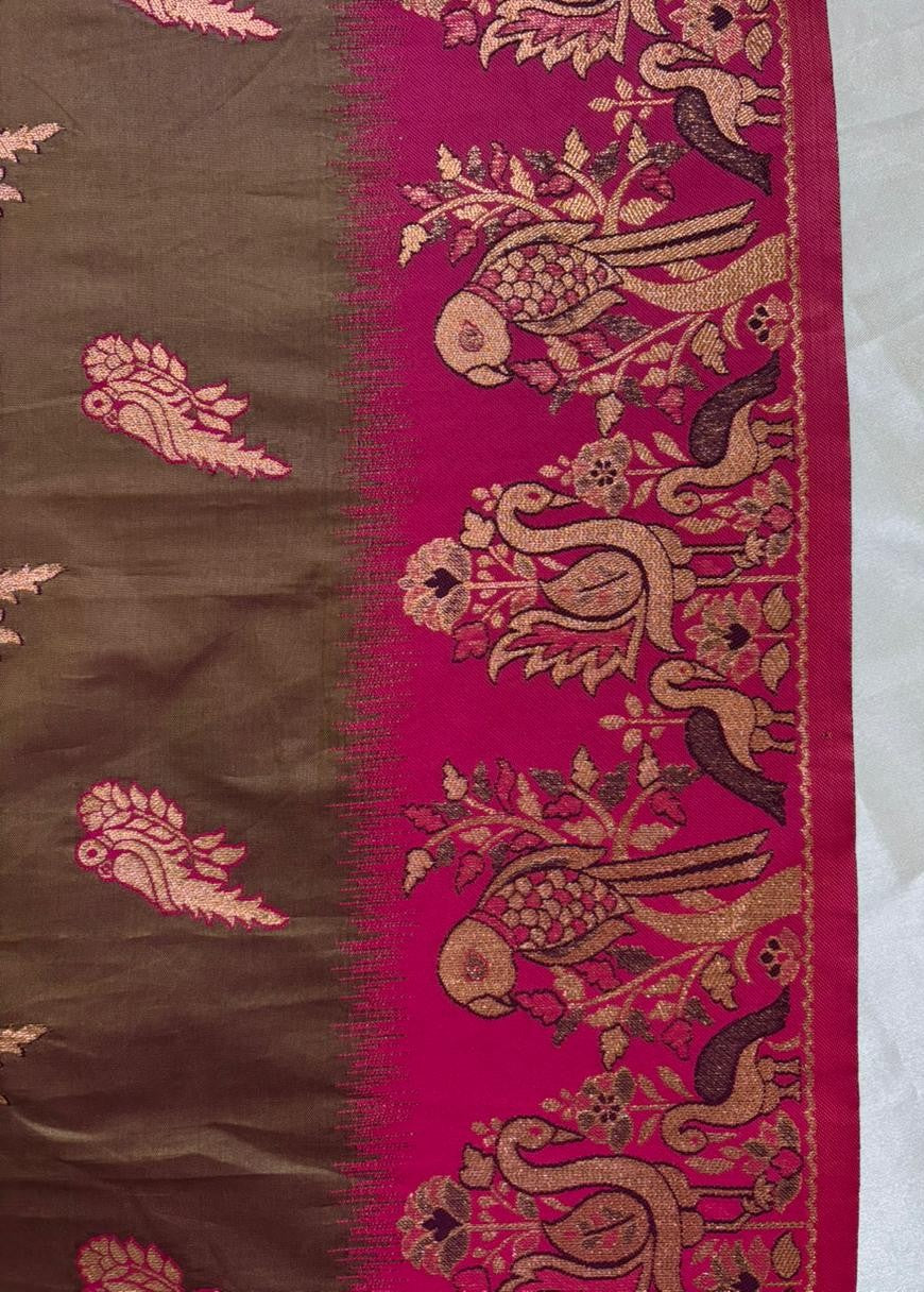 brown Baluchari Saree with pink border featuring intricate bird patterns