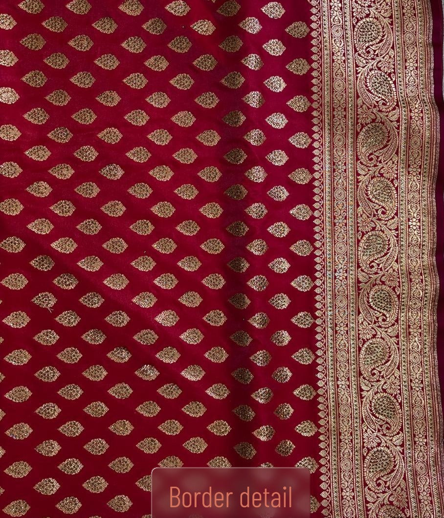 Intricate gold zari Border detailing on red Minakari Banarasi silk saree