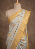 Ivory Beige and yellow Coloured Baluchari Saree on a Wooden torso