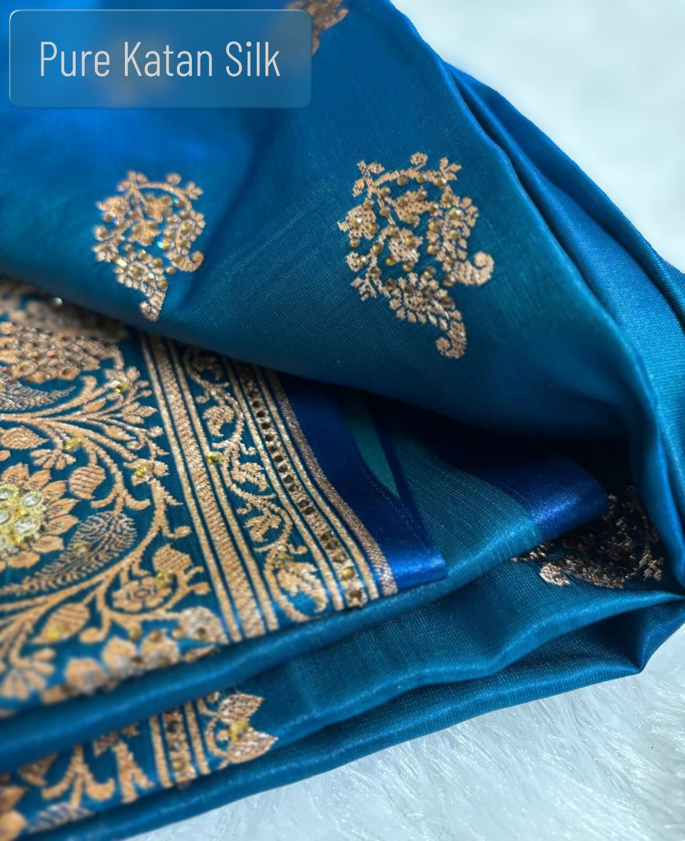 All-over floral buti golden zari pattern on pure silk teal Banarasi saree fabric