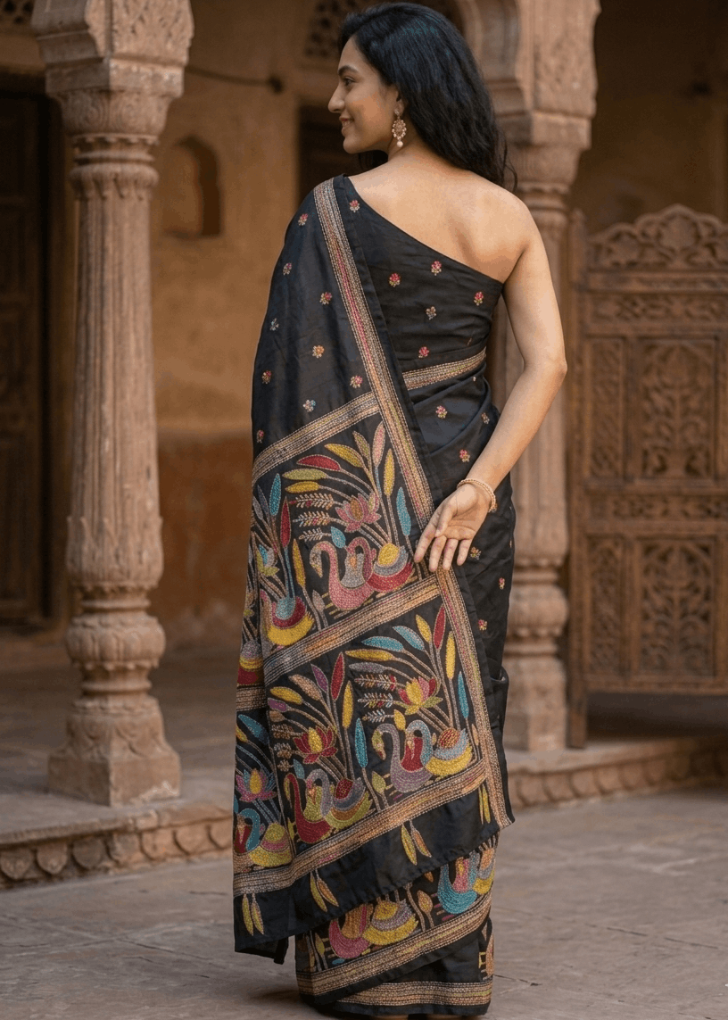 Elegant royal-blue MeghMalhar Kantha Saree featuring intricate multicolour handcrafted floral and folk-art embroidery with artistic pallu detailing. Premium Bengal handloom saree ideal for festive wear, cultural occasions, office elegance, and timeless ethnic fashion.