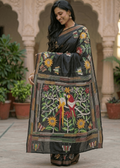 Woman wearing VanaPakshi Kantha saree with nature-inspired colorful motifs 