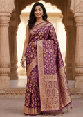 Wine purple floral jaal Banarasi silk saree with antique gold zari geometric pallu worn at heritage haveli setting